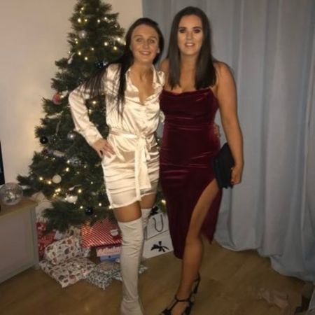 Laura Tobin on right poses a picture with her friend.